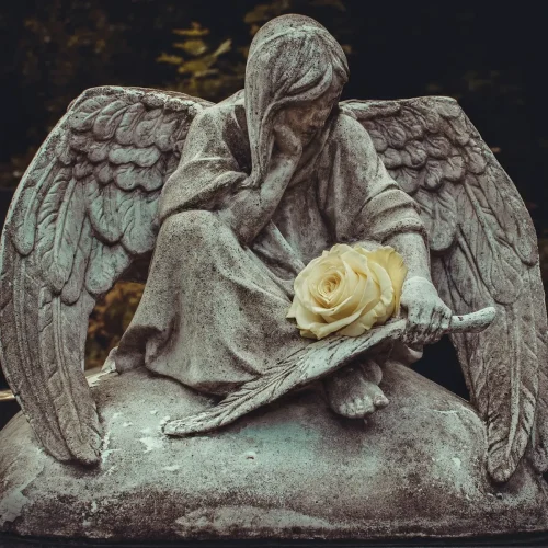 man sitting on rock statue